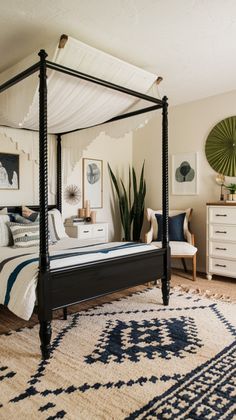 a bedroom with a four poster bed and rug