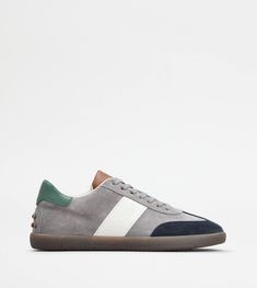 Tabs sneakers in soft suede with smooth leather inserts, logo stamped on the side and rubber outsole. An iconic style of Tod's world, with sober and refined lines. Gift Boutique, Grey And Beige, Logo Stamp, Grey Blue, Brown Beige, Trainers Women, Soft Suede, Green And Brown, Smooth Leather