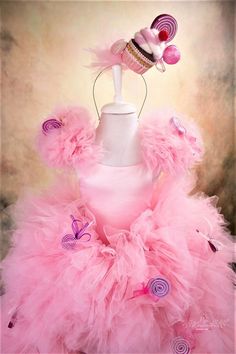 a dress made out of pink tulle and cupcakes