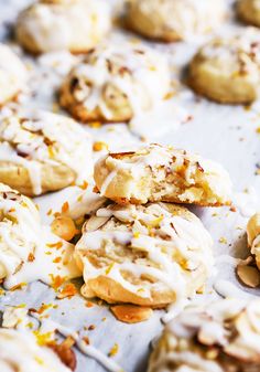 several cookies with white frosting and sprinkles