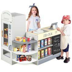 two children standing in front of a cash desk