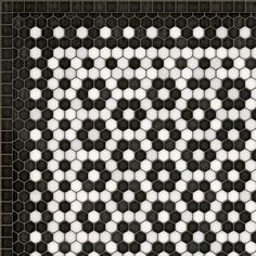 a black and white tile pattern that looks like hexagonal tiles