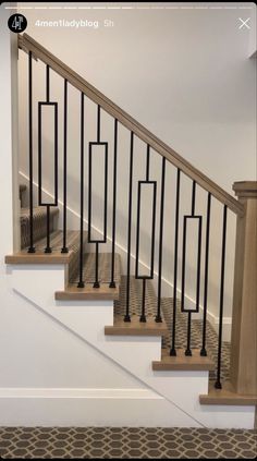 a set of stairs with handrails and carpet