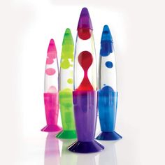 a group of multicolored rockets sitting on top of each other in front of a white background