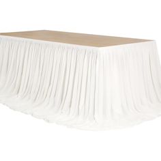 a white table with pleated skirt on top