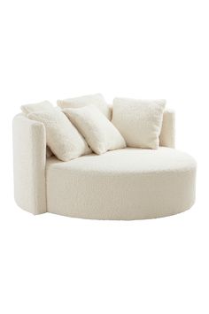 a white couch with pillows on it in the shape of a circle, against a white background