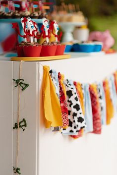 an assortment of cupcakes and cake on display