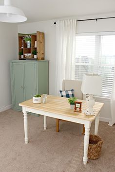 a living room with a table and chairs in it