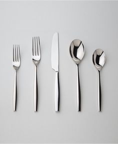 five forks, two spoons and one knife on a white surface