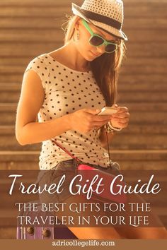 a woman in polka dot shirt and hat texting travel gift guide the best gifts for the traveler in your life