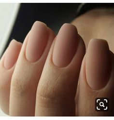 a woman's hand with long, thin nails on her left and right fingers