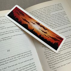 the bookmark is laying on top of an open book