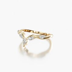 a gold ring with diamonds on it