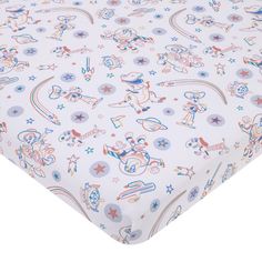 an image of a baby bed sheet with cartoon characters and stars on it's side