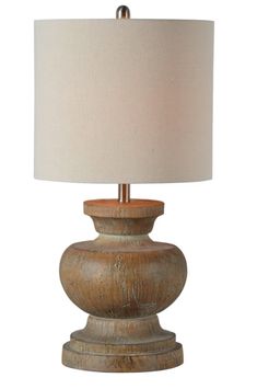 a wooden table lamp with a white shade