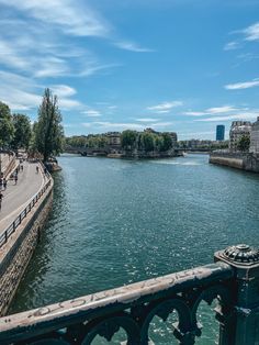 a river running through a city next to tall buildings