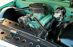 the engine compartment of an older model car