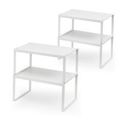 two white tables sitting next to each other