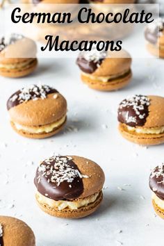 chocolate macarons with white sprinkles are on a baking sheet and the words, german chocolate macaroons