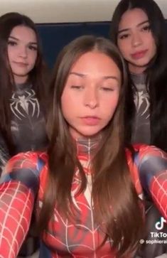 three girls in spider - man costumes are looking at the camera with their eyes closed