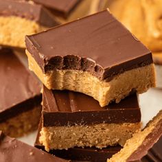 chocolate and peanut butter bars stacked on top of each other