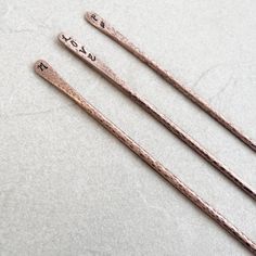 This listing is for 1 copper hair stick. If you would like more than 1 please adjustment the quantity in the drop down bar. Materials- solid 8 gauge copper wire Hand stamped with your choice of design or nothing at all. To view more of JKFoster designs click here: https://www.etsy.com/ca/shop/JKFoster?ref=l2-shopheader-name If you have any questions regarding this or another design. You can contact me via-Etsy conversation. Best Wishes! Joella Letter Symbols, Simple Pins, Hammered Hoop Earrings, Nothing At All, Copper Hair, Hair Stick, Custom Letters, Stick Pins, Lovely Earrings