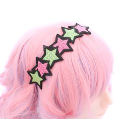 Bring a touch of celestial magic to your style with our Starlight Dreams Headband. This unique accessory features six stars embroidered in hot pink and neon green thread, using high-quality machine embroidery from a design made and digitized by me. Designed for unisex adults, this headband combines vibrant colors with intricate detailing. The elastic cord is securely sewn on, ensuring a comfortable and secure fit. Whether you're a fan of cosmic aesthetics or simply love unique accessories, this headband adds a whimsical and dreamy touch to your look. Make a statement with this creatively crafted headpiece that captures the magic of starry nights. Perfect for everyday wear or as a subtle touch for costume events, this headband is a must-have for those who appreciate celestial-inspired fashi Neon Clothing, Celestial Magic, Green Thread, Unique Hair Accessories, Neon Outfits, Kawaii Hairstyles, Statement Fashion, Streetwear Accessories, Art Accessories