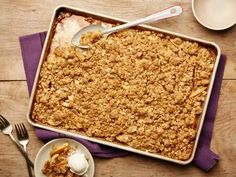 a casserole dish with ice cream and spoons