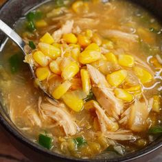 a bowl filled with chicken and corn soup