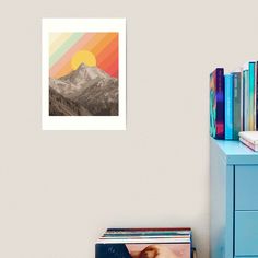 the mountains are covered in snow and sunset art print