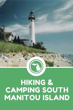 the cover of hiking and camping south manitou island, with a lighthouse in the background