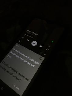 a cell phone that is lit up in the dark with someone's message on it