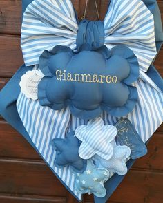 a blue and white door hanger that says giaamaro