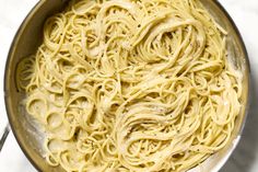 a pan filled with pasta on top of a table