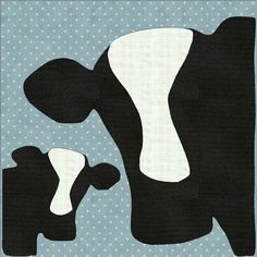 a black and white cow standing next to a blue polka dot wallpaper with dots on it