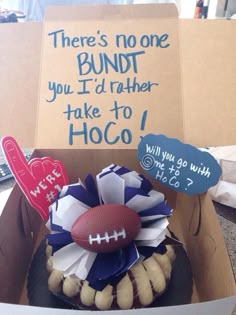 a football themed cake in a box for someone's birthday