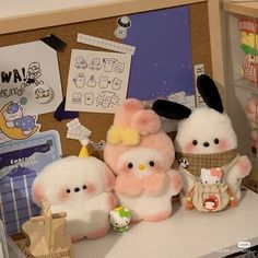 some stuffed animals are sitting on a table