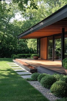 a modern house in the middle of a lush green park