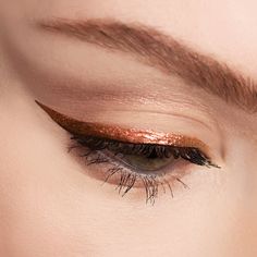 Description: Shine bright with pops of color on your eyelids with our DISSENT Eyeliner Collection. Get intense color payoff and ridiculously long wear with each of our richly-pigmented colors. ✨Delirium✨ is a gorgeous shimmering deep gold with burgundy undertones. This color is not vegan. All eyeliners in the collection are cruelty-free, gluten-free, paraben-free and waterproof. All made with 🖤 in the U.S . 💕 How to Apply: Using the thin, built-in brush, apply to your upper or lower lash lines Eyeliner For Brown Skin, Gold Eyeliner Looks, Copper Eyeliner, Shine Eyeliner, Bronze Eyeliner, Eyeliner Collection, Shimmer Eyeliner, Nude Eye Makeup, Glittery Eyeshadow