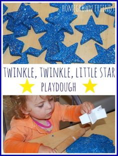 a toddler playing with blue glittered stars and cutting them into playdoughs