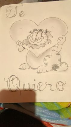 a drawing of a cat holding a heart with the word quero written on it