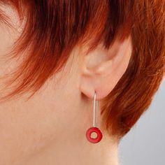 "Luscious bright cherry red glass enamel kiln-fired onto a copper O-ring shape suspended by a slender yet sturdy wire of sterling silver. A charming style that you can dress up or down. These earrings are feather-light! The overall length of the earrings is 1-1/8\" (3 cm). The powdered glass enamel is kiln-fired onto a copper disc 3/8\" (10mm) in diameter. The sterling earwire is hard soldered onto the enameled copper disc. I include a pair of clear rubber earhook \"keepers\" with all earrings, Minimalist Red Round Earrings, Red Sterling Silver Earrings For Everyday, Red Circular Jewelry For Gifts, Red Circle Jewelry For Gift, Modern Red Jewelry For Gifts, Modern Red Teardrop Jewelry, Modern Red Jewelry For Everyday, Modern Red Everyday Jewelry, Red Round Enamel Earrings