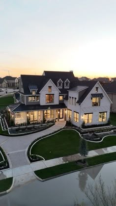 an aerial view of a large house at dusk