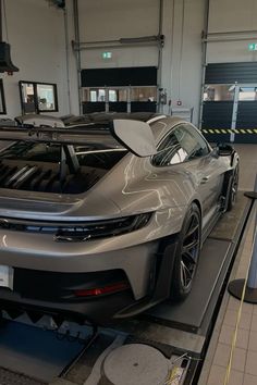 a car is being worked on in a garage