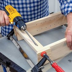 a man is working with wood and tools