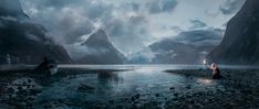 two people standing in the middle of a body of water with mountains in the background