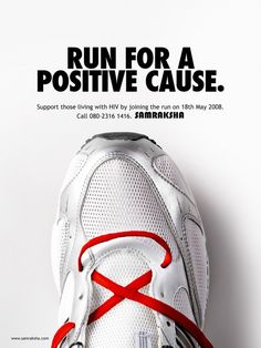 a white shoe with red laces on it and the words run for a positive cause