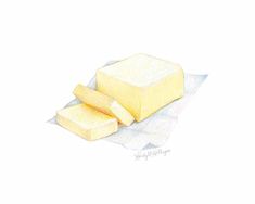 a piece of butter sitting on top of a white paper next to two slices of cheese