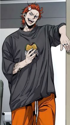 a man with red hair wearing an orange pants and a black t - shirt holding a sandwich