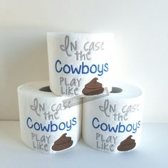 three rolls of toilet paper with the words cowboys on them